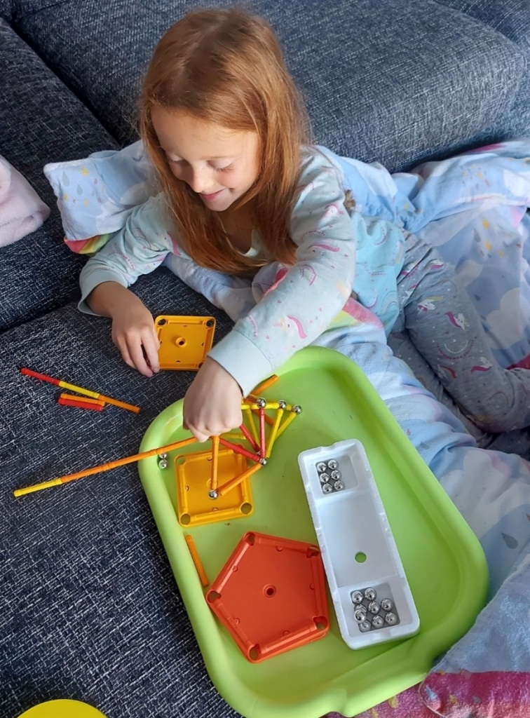 Lazy mornings building with her magnets!
